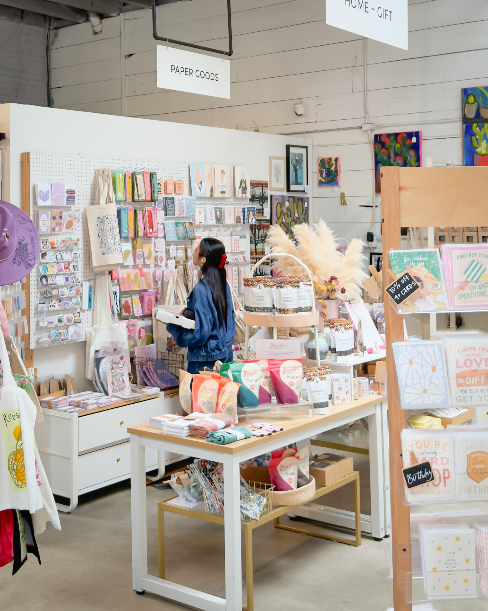 Customer shopping inside a colorful handmade goods store
